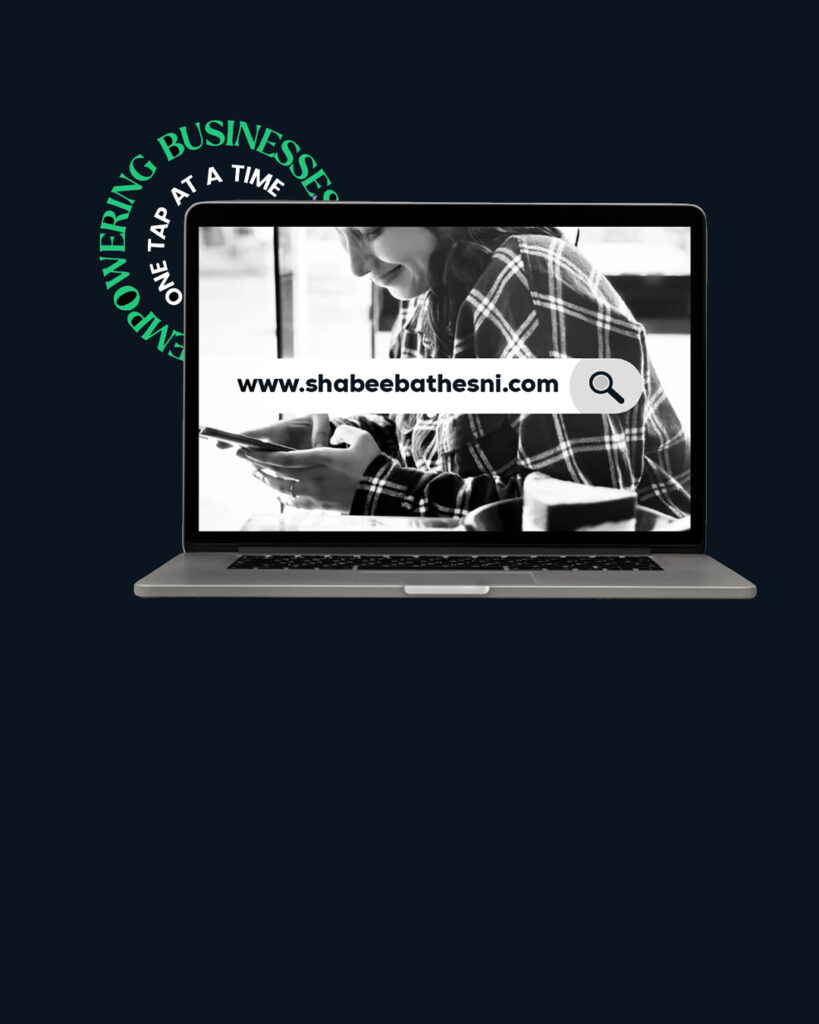 “Laptop displaying the website ‘www.shabeebathesni.com’ with a search bar on screen, showing a person using a smartphone and the tagline ‘Empowering Businesses One Tap at a Time’ on a dark background.”